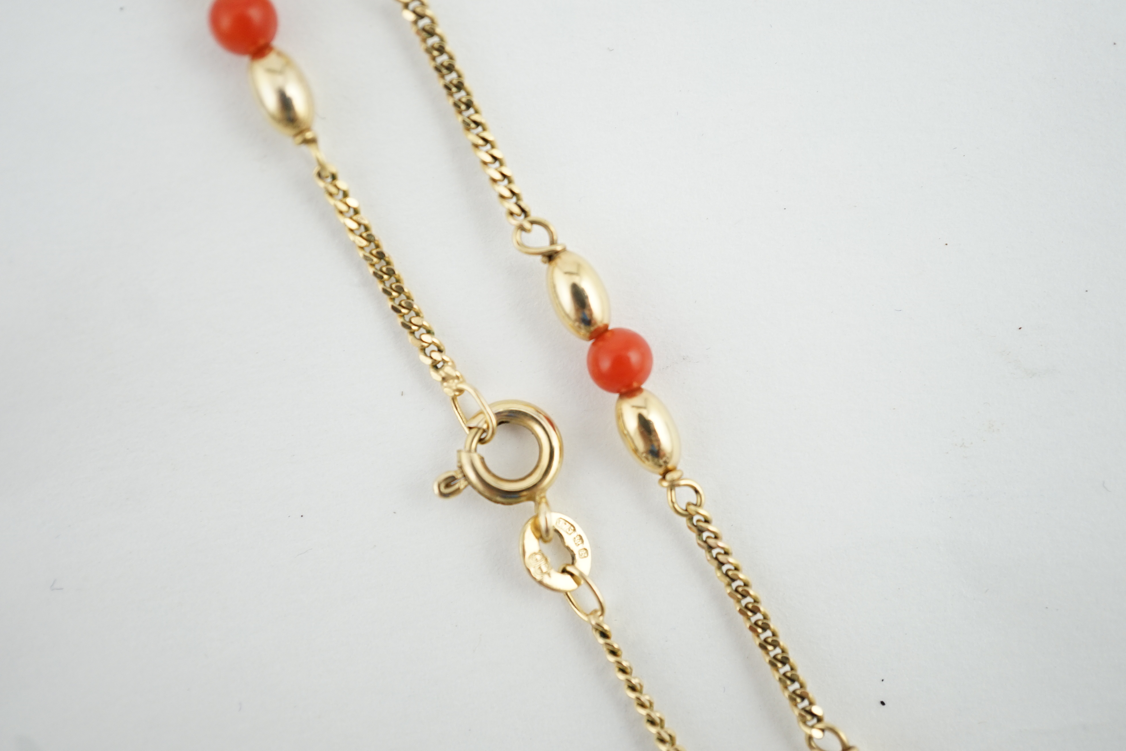 A modern 9ct gold and coral bead chain necklace